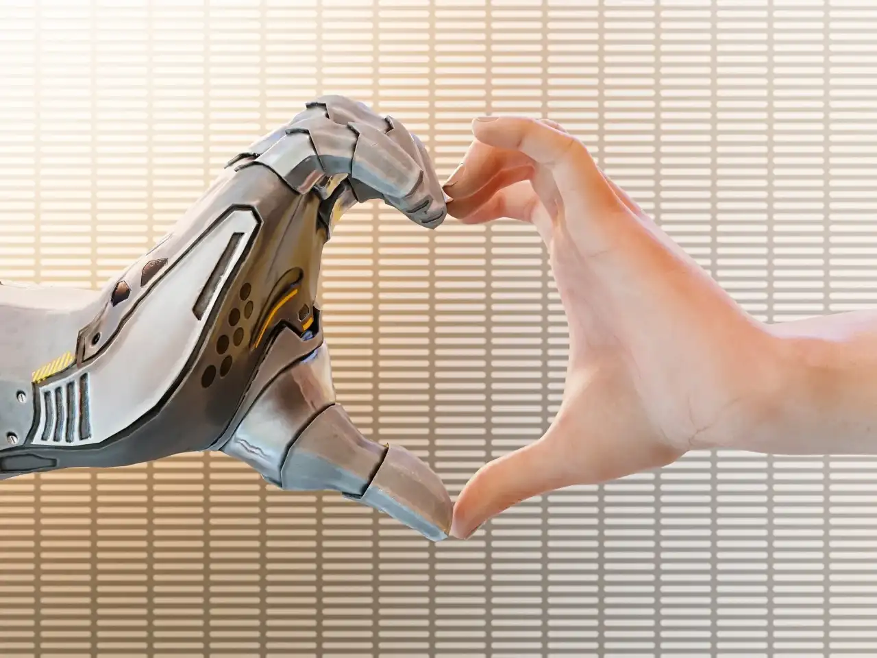 Mãos humana e robótica fazendo um gesto de coração, simbolizando a interação entre humanos e inteligência artificial.